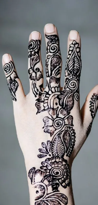 Intricate henna design on hand close-up.