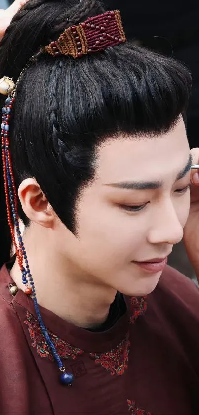 Elegant portrait of a person in traditional Chinese attire with accessories.