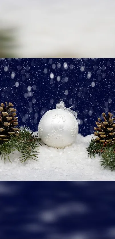 Holiday winter scene with white ornament and pinecones in snow.