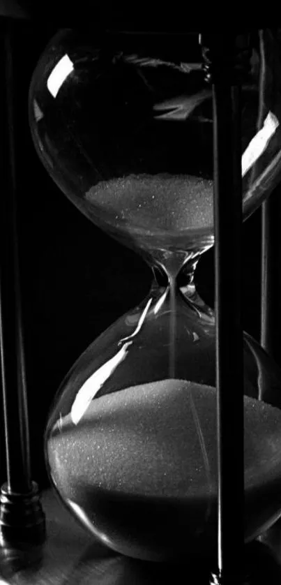 Black and white hourglass design wallpaper.