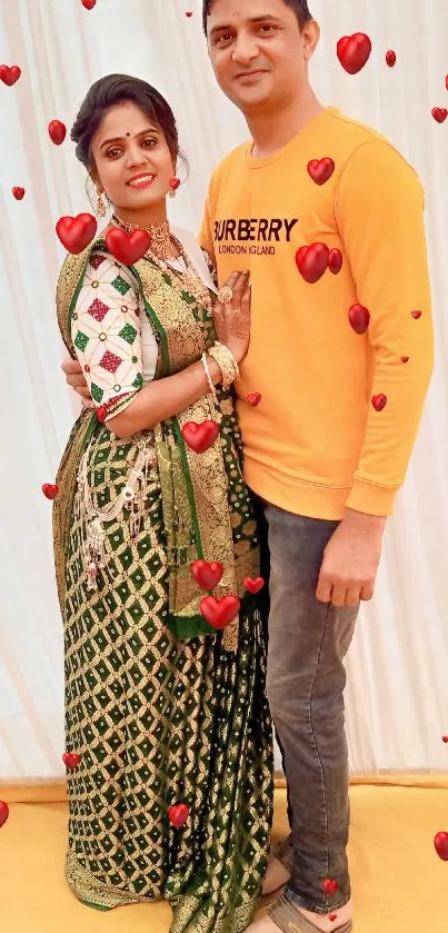 Elegant Indian couple in traditional attire with a golden background.