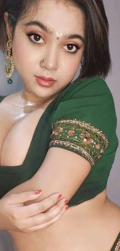 Elegant woman in traditional Indian attire with green blouse.