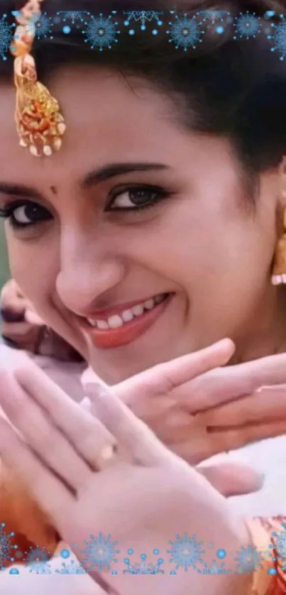 Woman in traditional Indian attire with elegant jewelry and bright smile.