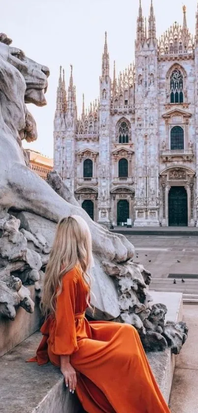 Woman in orange dress admiring iconic Italian cathedral.