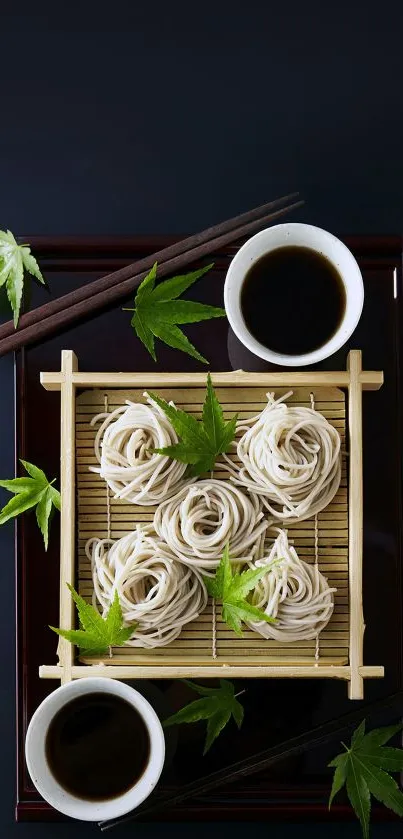 Artistically arranged soba noodles with leaves on a bamboo tray.