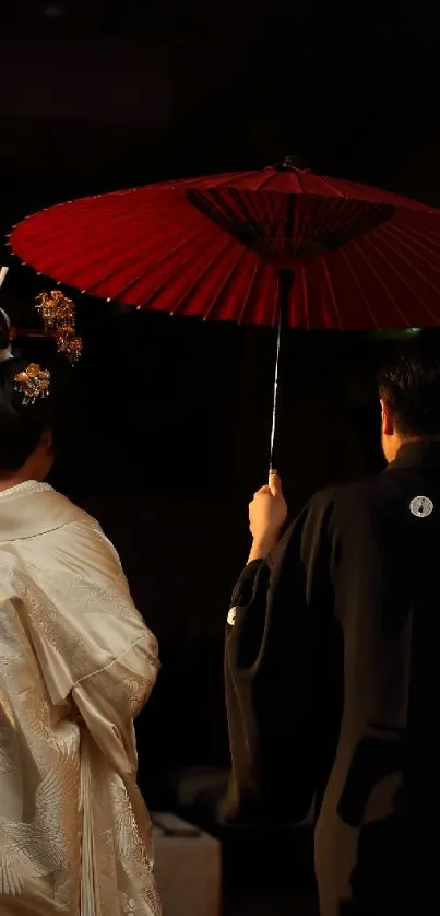 Elegant scene of a couple in traditional Japanese attire with a red umbrella.