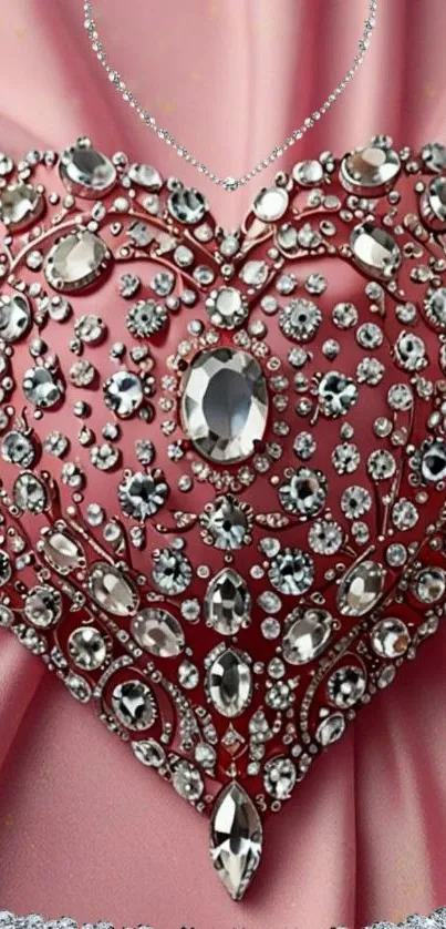 Jewel-encrusted heart on a pink satin background.