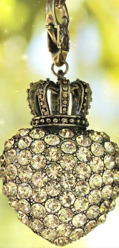 Jeweled heart pendant with crown in nature setting, sparkling details.