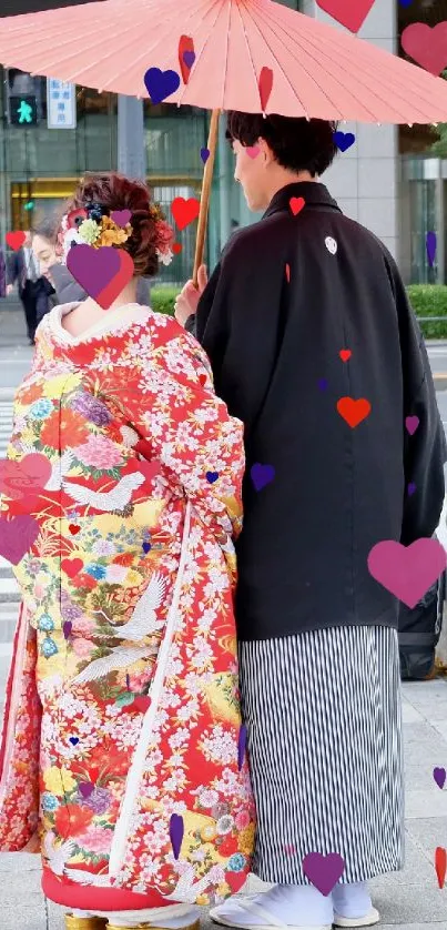 Couple wearing traditional kimonos under a red umbrella.