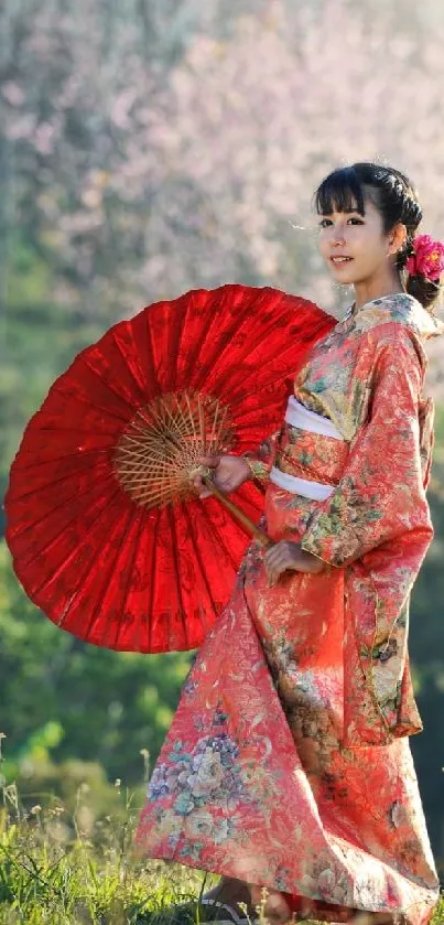 Woman in red kimono with parasol in natural setting.