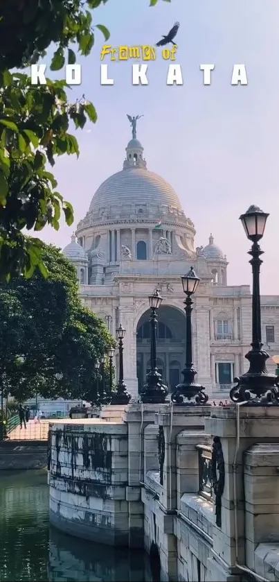 Kolkata architecture framed by trees and an elegant bridge.