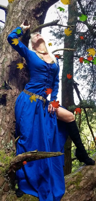 Woman in vibrant blue dress standing against a tree in a forest setting.