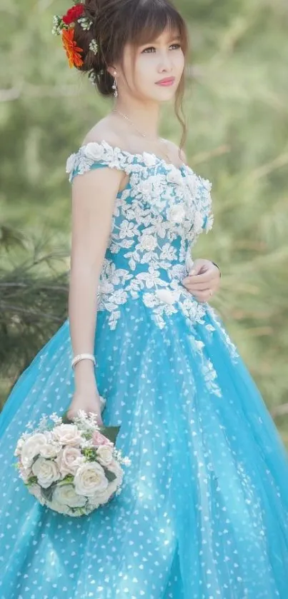 Woman in blue gown holding flowers outdoors.