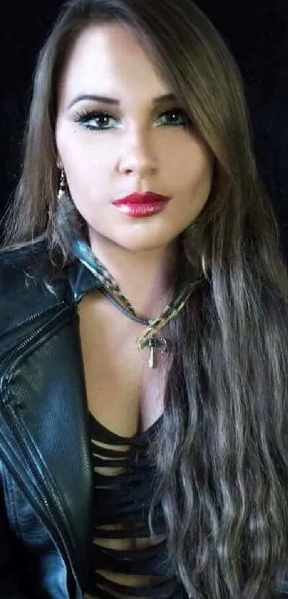 Woman in a black leather jacket with long hair.