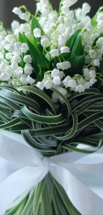 Elegant bouquet of Lily of the Valley with white and green tones.
