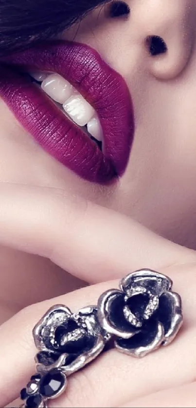 Close-up of alluring lips with silver rose rings.