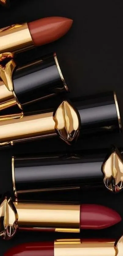 Elegant lipstick arrangement with black and gold.