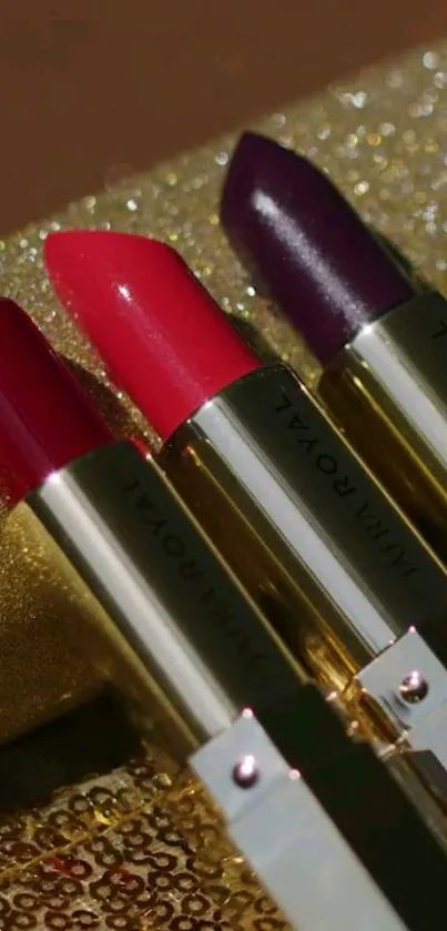 Luxurious lipsticks with a glittering gold background.