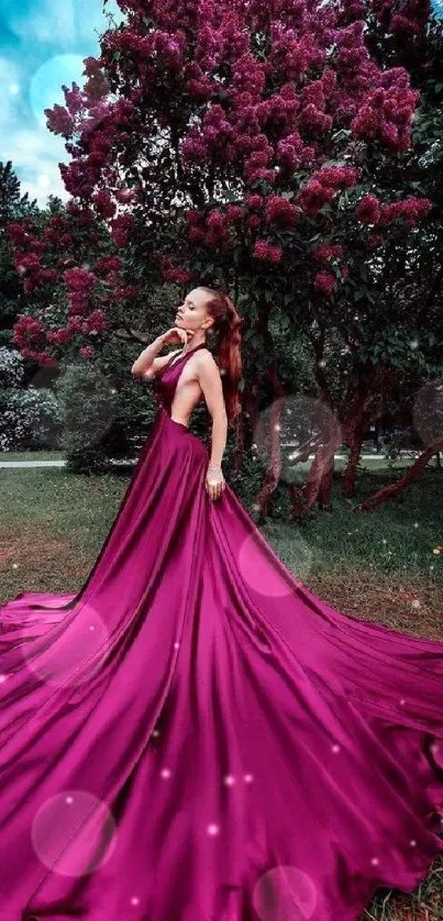 Woman in magenta gown in lush garden landscape.