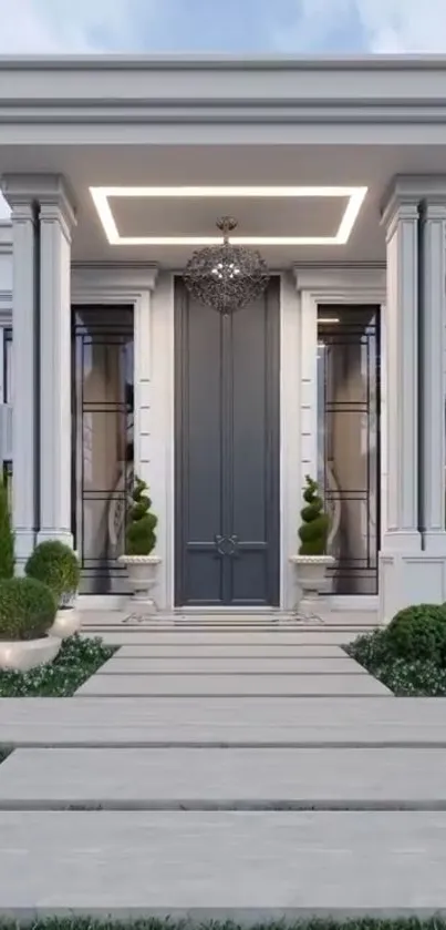 Elegant mansion entrance with columns and greenery.