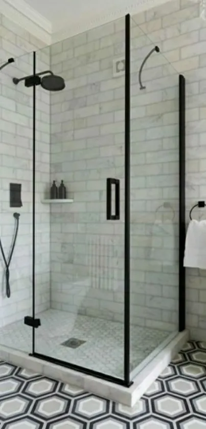 Elegant marble bathroom with glass shower and geometric tiled floor.