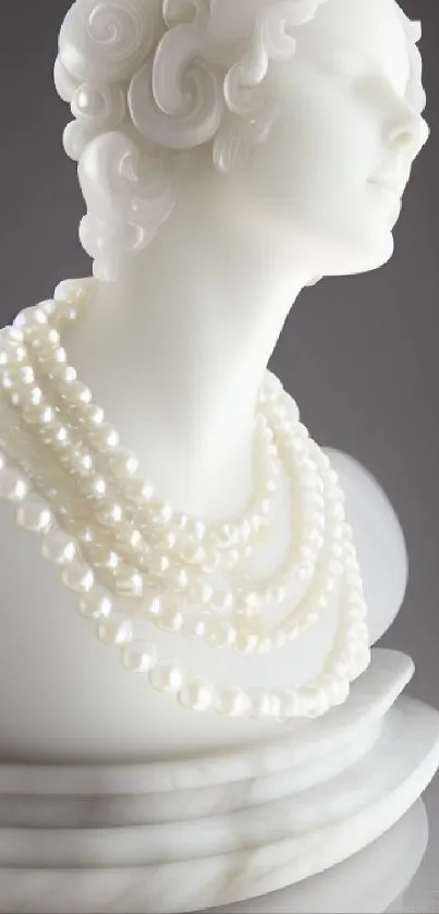 Marble bust adorned with pearl necklaces on a sleek background.