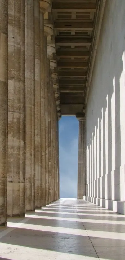 Elegant marble columns with sky view in a classic architectural setting.