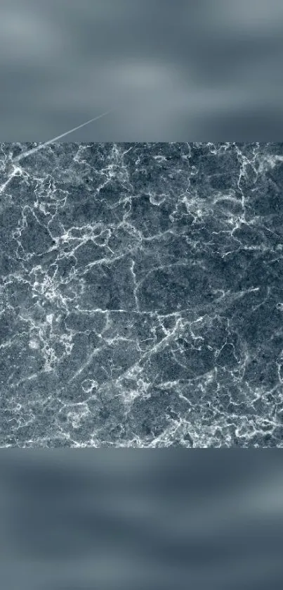 Gray marble texture wallpaper with white veins.