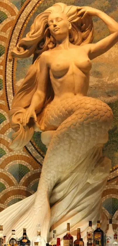 Marble mermaid statue against mosaic background with bottles at the base.