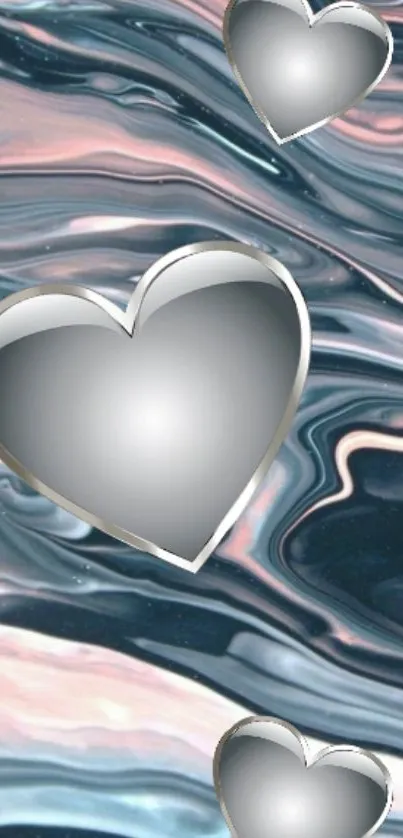 Metallic hearts on abstract, flowing pastel blue background.