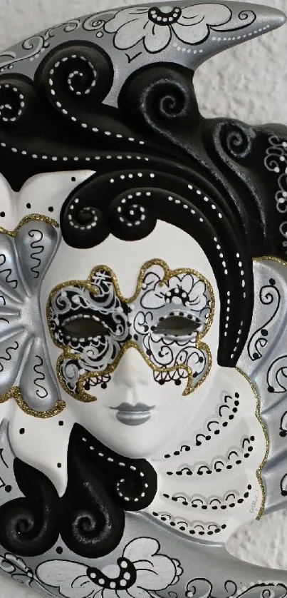 Elegant monochrome mask with intricate black and white design.