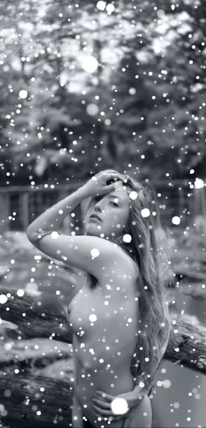 Monochrome wallpaper with woman in nature surrounded by artistic snow-like dots.