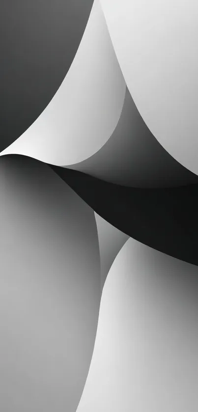 Abstract monochrome wallpaper with curved black and gray shapes.