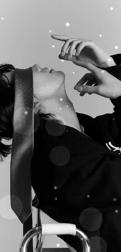Monochrome portrait wallpaper of person with head tilted back.