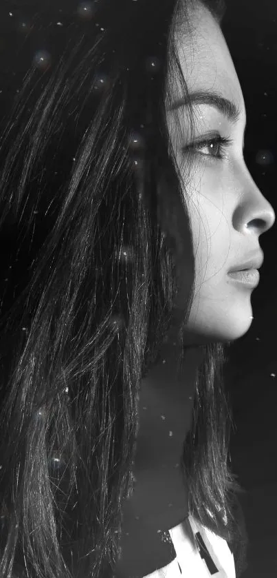 Monochrome profile portrait wallpaper with starry accents.