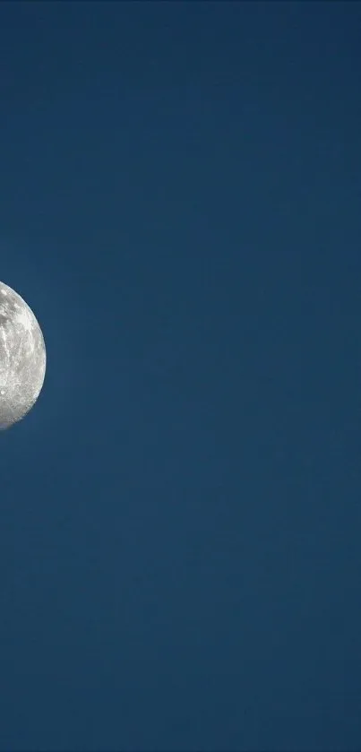 Moonlit sky wallpaper with dark blue background.