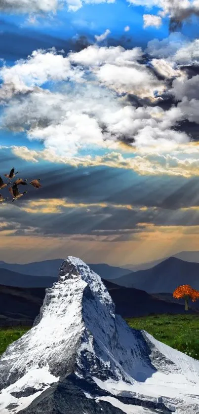 Snow-capped mountain with vibrant blue sky and sunlit clouds.