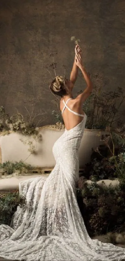 Woman in white gown on sofa with nature backdrop.