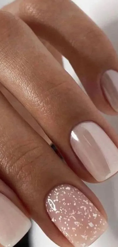 Elegant nude manicure with chic nail art.