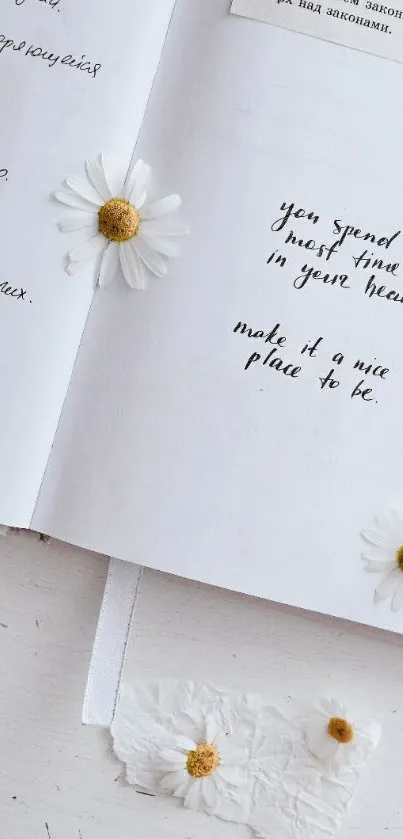 Open notebook with daisies and elegant handwritten text