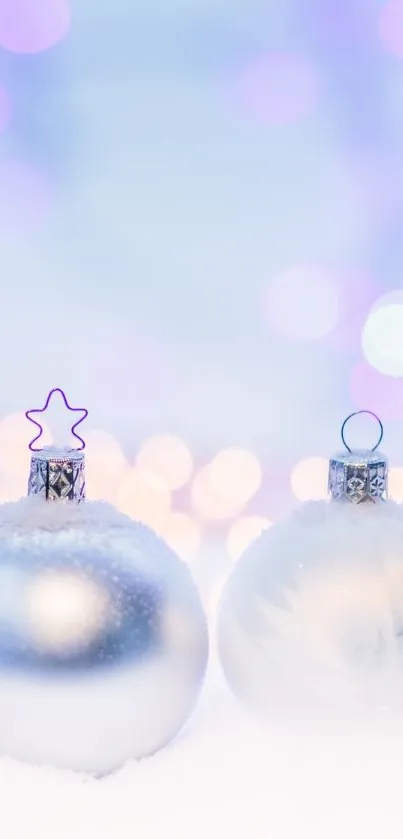 Elegant Christmas ornaments in snow with purple bokeh.