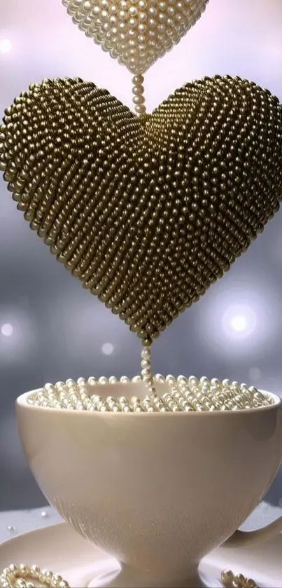 Pearl heart above a teacup in elegant design.