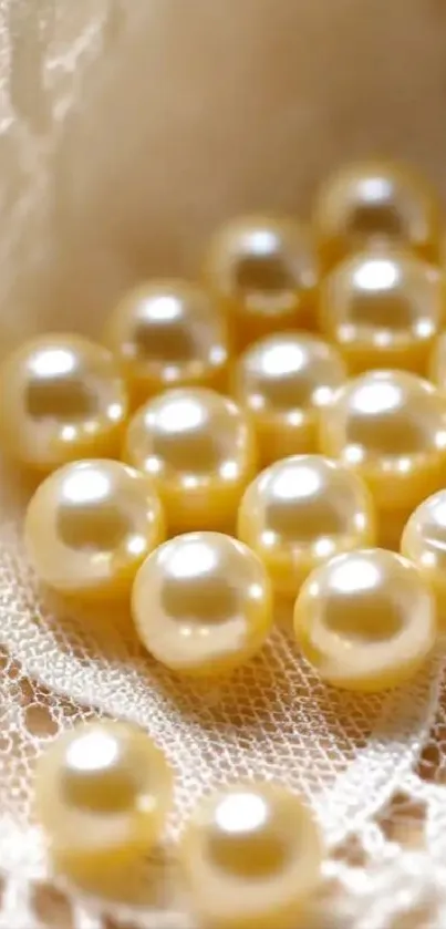 Soft-focus pearls on lace background wallpaper.