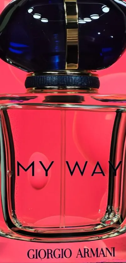 Elegant perfume bottle against vibrant pink background.