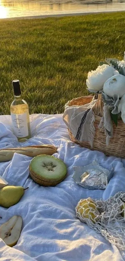 Serene lakeside picnic at sunset with flowers and wine.