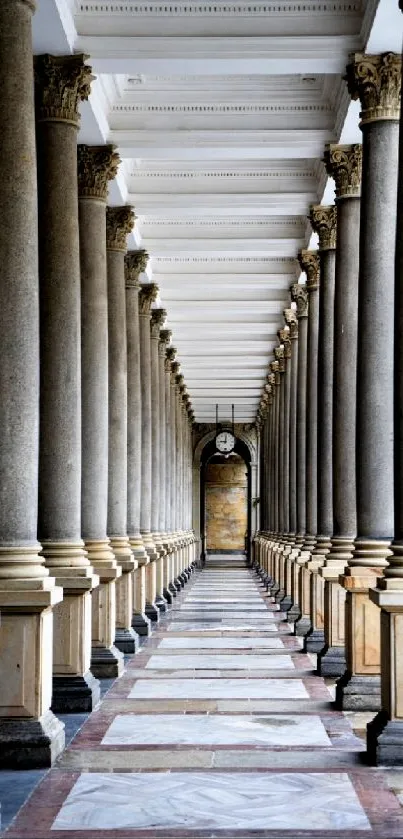 Elegant corridor with stone pillars and classic architectural design.