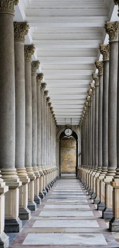 Elegant corridor with lined stone columns and symmetrical design.