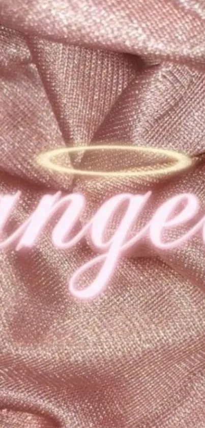 Soft pink fabric wallpaper with angelic halo and text design.