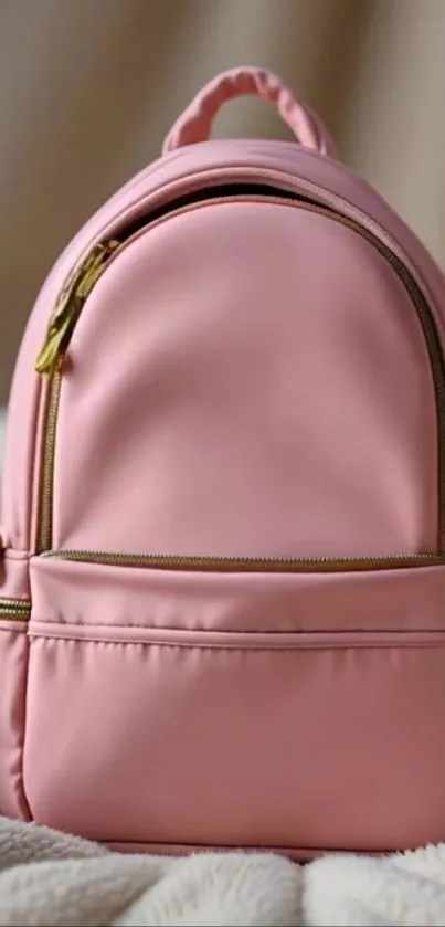 A stylish pink backpack on a soft background.