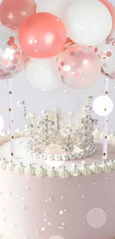 Pink cake with balloons and a crown decoration.